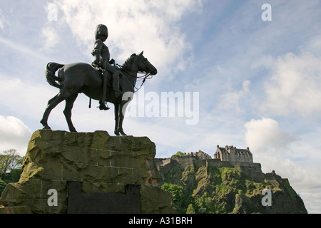 Edinburgh Castle from Princess Street Edinburgh Scotland with Monument to Royal Scots Greys in foreground Stock Photo