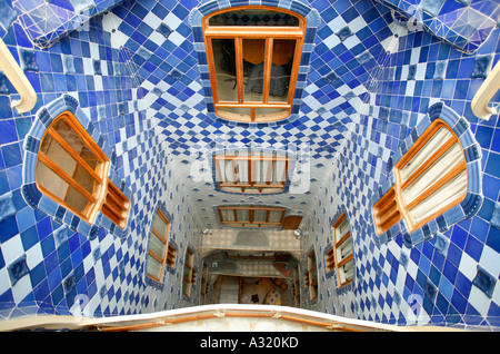 View down central stairwell of Casa Batllo showing tiles and windows, Barcelona Stock Photo