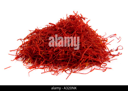 Saffron strands on a white background Stock Photo