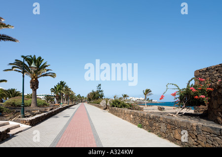 Promenade and Beach, Playa Bastian, Costa Teguise, Lanzarote, Canary Islands, Spain Stock Photo