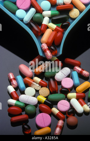 pharmacist counting tray with various pills capsules tablets gel caps Stock Photo