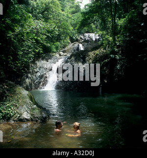 Couple bathing by Argyle Falls near Scarborough, Tobago, Trinidad and Tobago, West Indies, Caribbean Stock Photo