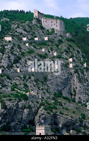 The long path leading back and forth up to Entrevaux citadel in Provence France Stock Photo