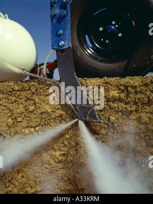 ANHYDROUS AMMONIA APPLICATION KNIFE SHOWING BURST OF AMMONIA / LANCASTER COUNTY, PENNSYLVANIA Stock Photo