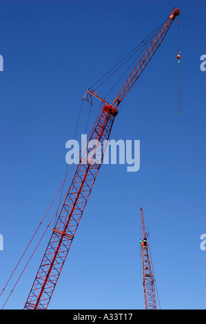 Construction cranes against blue sky orlando florida america usa Stock Photo