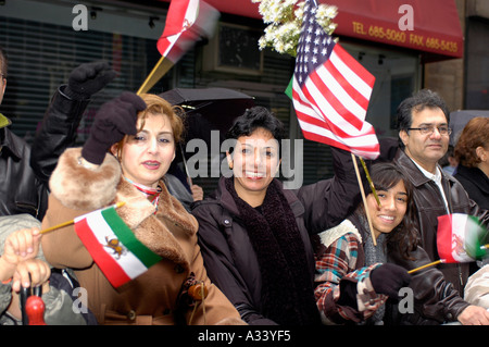 Iranian Americans gather for the Iranian Persian Parade on Madison Ave in New York City on the first day of spring The parade which celebrates Nowruz Iranian New Year s coincided with the first day of spring and was welcomed in by spring showers The parade goers were undaunted by the inclement weather and hundreds marched and watched Stock Photo