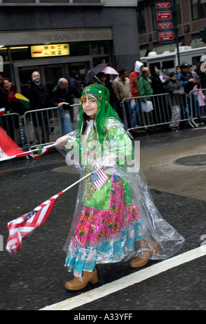 Iranian Americans gather for the Iranian Persian Parade on Madison Ave in New York City on the first day of spring The parade which celebrates Nowruz Iranian New Year s coincided with the first day of spring and was welcomed in by spring showers The parade goers were undaunted by the inclement weather and hundreds marched and watched Stock Photo