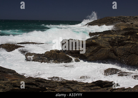 waves crashing over rocks at vivonne bay, kangaroo island, south australia Stock Photo