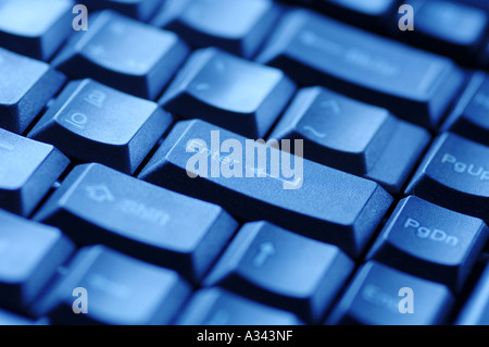 computer keyboard under blue light, enter key Stock Photo