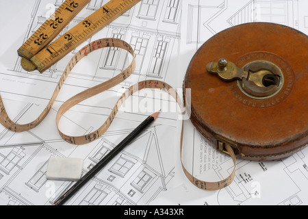 Tape measure and pencil on Architects technical drawings Stock Photo