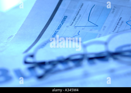 business newspaper with glasses on top Stock Photo