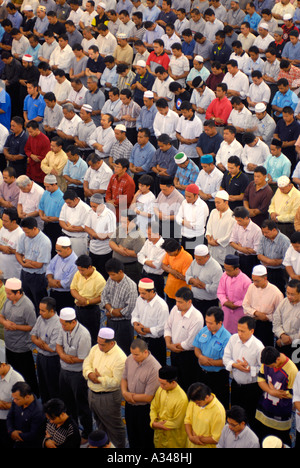 Muslim men at Friday prayer in the National Mosque, Kuala Lumpur, Malaysia Stock Photo