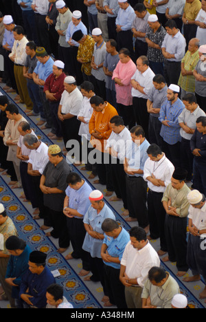 Muslim men at Friday prayer in the National Mosque, Kuala Lumpur, Malaysia Stock Photo