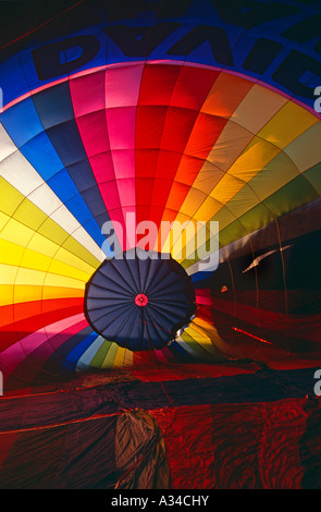 View from inside a multi-coloured, striped, hot air balloon during inflation, England Stock Photo