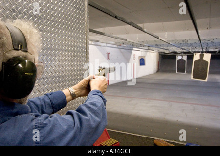 American indoor gun shooting range Male shooter at target practice Las Vegas Nevada Shooting gallery Stock Photo