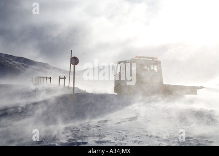 Blizzard on Scottish winter roads The Glenshee ski area, Vehicle on the Cairnwell Pass on the A93 between Glenshee & Braemar, Highlands, Grampian, UK Stock Photo