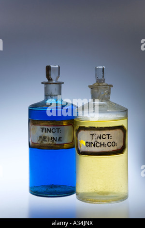 Coloured Liquid in Chemists glass;  stoppered Pharmacy Bottles; Apothecary, tincture, solution, medicine jars Victorian stock solutions of chemicals. Stock Photo