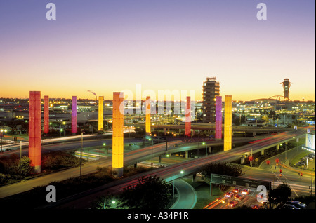 Colorful illuminated pylons form a decorative sight where Century Boulevard reaches Los Angeles International Airport, LAX Stock Photo