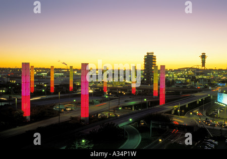 Colorful illuminated pylons form a decorative sight where Century Boulevard reaches Los Angeles International Airport, LAX Stock Photo