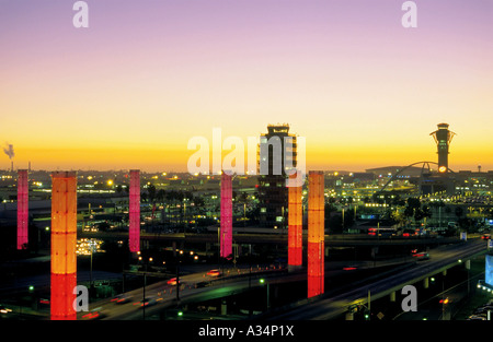 Colorful illuminated pylons form a decorative sight where Century Boulevard reaches Los Angeles International Airport, LAX Stock Photo