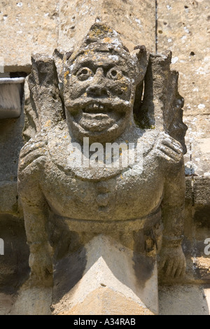 Weathered gargoyle eroded by acid rain St Peters Church Winchcombe UK Stock Photo