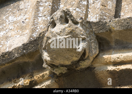 Weathered gargoyle affected by acid rain St Peters Church Winchcombe UK Stock Photo