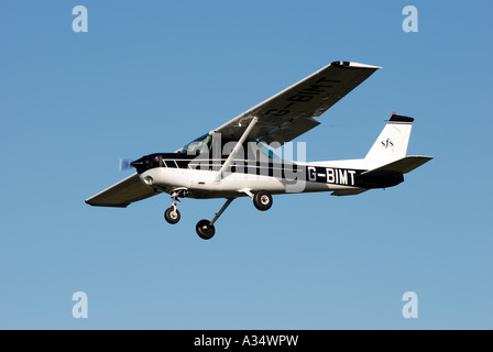 Cessna FA 152 aircraft landing at Gloucestershire Airport, Staverton, Gloucestershire, England, UK Stock Photo