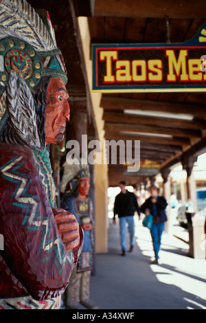 Cigar store Indian stands outside the entrance to the Taos Mercantile store Taos New Mexico Stock Photo