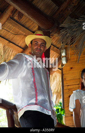 Male dancer resting between performances in a restaurant, near Holguin, Cuba Stock Photo
