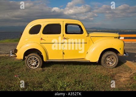 Yellow 1952 Ford Prefect classic British car parked at the roadside, Trinidad, Sancti Spiritus Province, Cuba Stock Photo