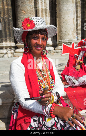 Lady holding a pipe and cigar, sitting on Cathedral steps, Plaza de la Catedral, Havana, La Habana Vieja, Cuba Stock Photo