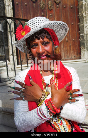 Lady, arms crossed, smoking cigar and pipe, on Cathedral steps, Plaza de la Catedral, Havana, La Habana Vieja, Cuba Stock Photo