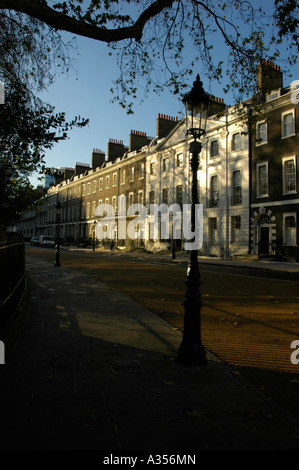 Evening sunlight reflected off Georgian buildings in Bedford Square, Bloomsbury, London, England, UK Stock Photo