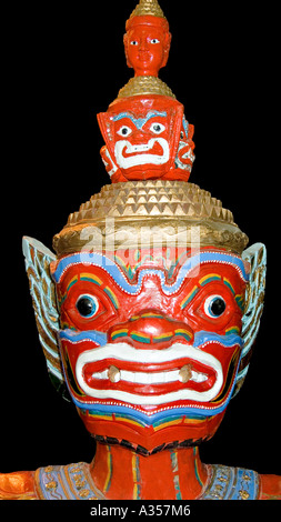 Brightly painted wooden sculpture of a Temple Guardian Thailand Stock Photo