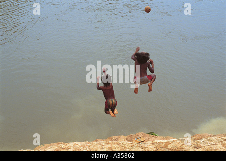 A Ukre Village Brazil Two Kayapo Boys Jumping Into The 