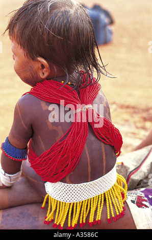 A Ukre village Brazil Kayapo girl with beads and black body paint from the back Xingu Indigenous Reserve Stock Photo