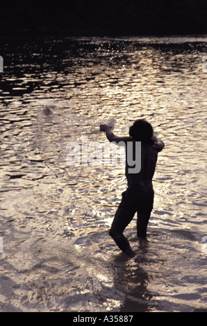 A Ukre village Brazil Kayapo man fishing using a net Xingu Indigenous Reserve Stock Photo