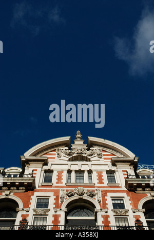 Stunning classical orange brick and white stone architecture above shops on Oxford Street in London Stock Photo