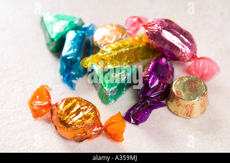 a pile of sweets in colourful wrappers Stock Photo - Alamy