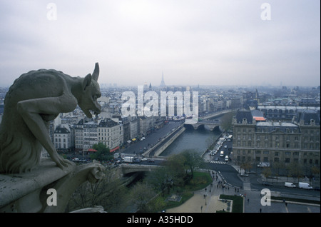 One of the many gargoyles atop Notre Dame Cathedral looking out over the city of Paris prior to the devastating April 15, 2019 fire. Stock Photo