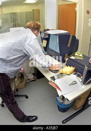 Young Man office Interior Art Director, Working on Computer  PUBLISHING Business COMPANY Technician, people working on MAC, magazine editor Stock Photo