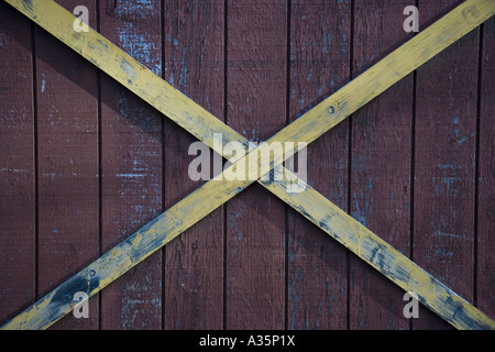 Boards forming an x on the side of a barn Stock Photo