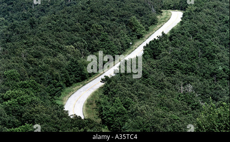 A road goes through the Ouachita National Forest which covers 1 8 million acres in southeastern Oklahoma and central Arkansas Stock Photo