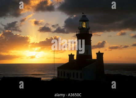 Cape Agulhas Lighthouse in South Africa at the southernmost tip of the African continent where two oceans meet Stock Photo