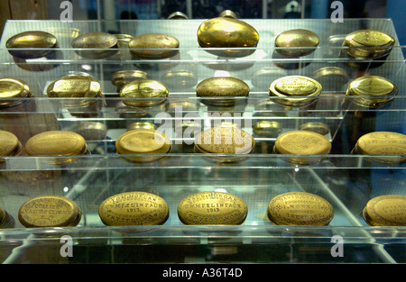 Exhibition of miners snuff and chewing tobacco brass boxes Big Pit National Coal Museum Blaenavon South Wales UK Stock Photo