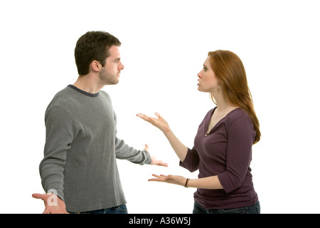 Young couple having a noisy argument and gesturing angrily at each other Stock Photo