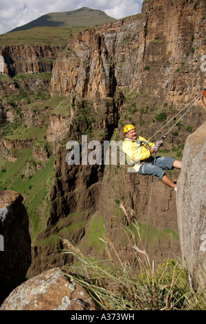 a-man-begins-his-abseil-down-the-maletsunyane-falls-in-lesotho-stock