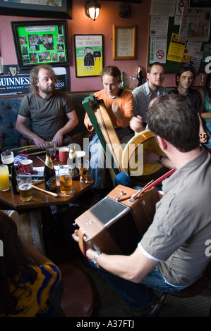 A traditional music session in Falvey's bar during Puck Fair, Killorglin, County Kerry, Ireland Stock Photo