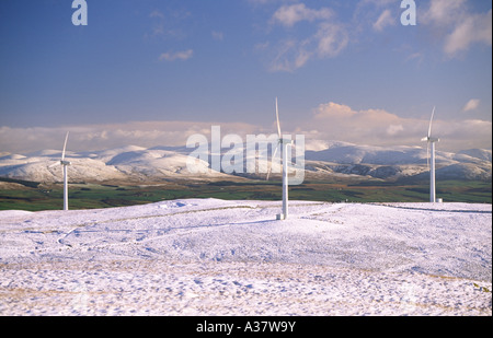 A snow covered winter landscape when electricity supply is in high demand wind turbines generating electricity Hare Hill UK Stock Photo