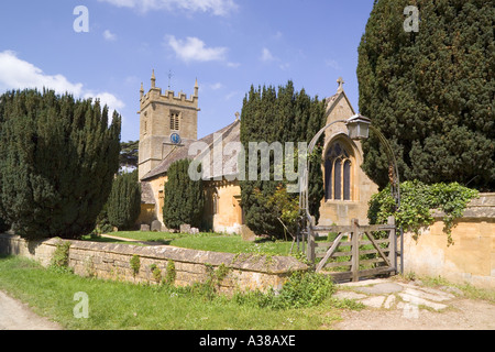 The Cotswold church of St Peter adjoining the manor house at Stanway, Gloucestershire Stock Photo